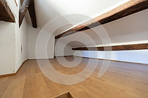 Attic with wooden beams and parquet