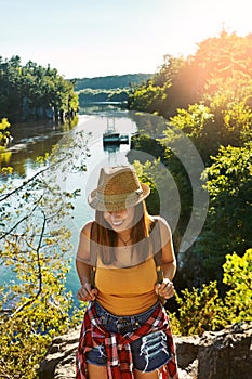 Attitude is the difference between and ordeal and an adventure. a young woman out hiking.