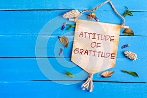 Attitude of gratitude text on Paper Scroll photo