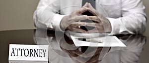 Attorney Businessman at Desk with Papers and Card Making Hand Gestures