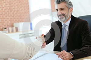 Attorney and client handshaking photo