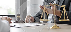 Attorney or judge provides legal advice to the client in the courtroom photo