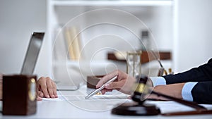 Attorney showing woman where to sign divorce document, legal consultation photo