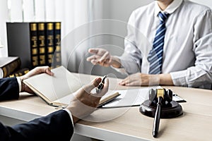 Attorneys or lawyers are advising clients in defamation cases. photo