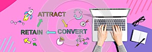 Attract convert retain concept with person using a laptop