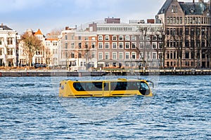 Attraction in Rotterdam, an amphibious vehicle in the river `de Maas`