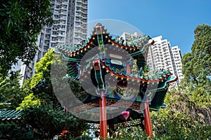 Attractions of Wong Tai Sin Temple against the modern skyscrapers, Hong Kong