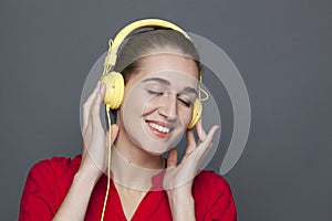 Attractive 20s girl for trendy headphones concept