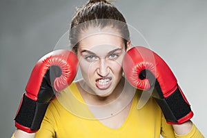 Attractive 20s woman threatening to fight for success or revenge