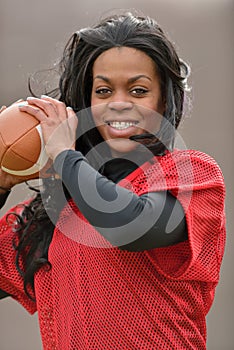 Attractive African American woman football player