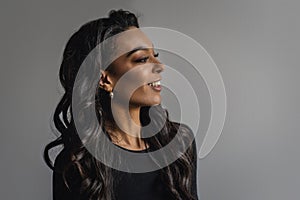 Attractive african american woman portrait against grey background