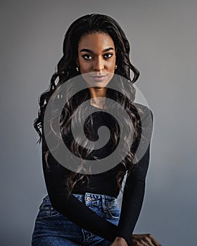 Attractive african american woman portrait against grey background