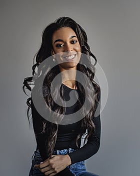 Attractive african american woman portrait against grey background