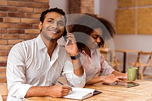 Attractive Afro-American couple working