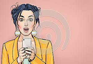 Attractive amazed young woman  with mobile phone in hand. Wow girl in comic style. Pop art woman holding smartphone.