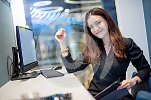 Attractive Asian businesswoman working in office