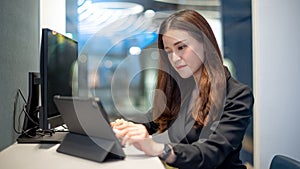 Attractive Asian businesswoman working in office