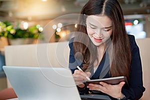 Attractive Asian businesswoman working in office