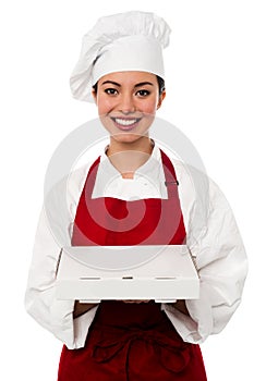 Attractive asian female chef delivering pizza