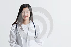 Attractive Asian female doctor looking at camera with smiling face,  on white background with copy space. studio shot