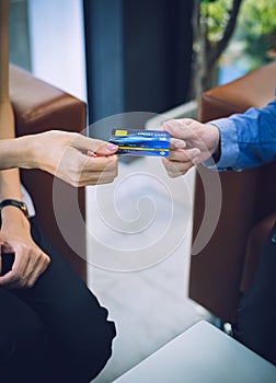 Attractive Asian girl millenials buying a new car with credit card. Film effected