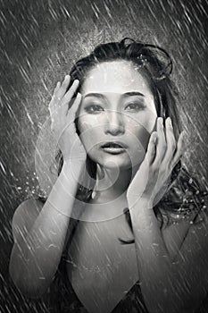 Attractive asian lady in rain