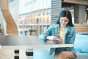 Attractive Asian woman drinking coffee.cheerful girl drinking coffee or tea in morning