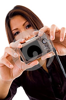 Attractive asian woman holding camera