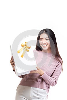 Attractive asian woman holding gift box in christmas, new year, valentine day, birthday celebration concept. Portrait of smiling