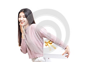 Attractive asian woman holding gift box in christmas, new year, valentine day, birthday celebration concept. Portrait of smiling