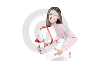 Attractive asian woman holding gift box in christmas, new year, valentine day, birthday celebration concept. Portrait of smiling