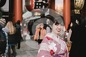 Attractive asian woman wearing kimono at Sensoji Asakusa Temple, Tokyo, Japan