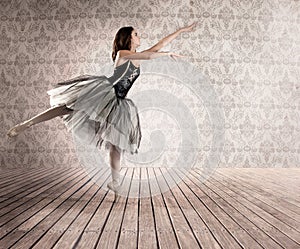 Attractive ballerina on tiptoe