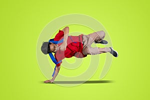 Attractive bboy break dancing in the studio photo