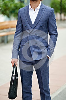 Attractive bearded young man in classic suit. Elegancy and male