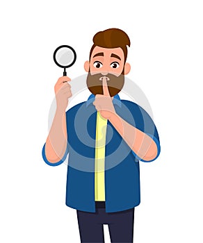 Attractive bearded young man holding magnifying glass and asking silence, keep quiet, shh, silence please! Search, find, discovery