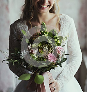 Attractive Beautiful Bride Holding Flowers Bouquet