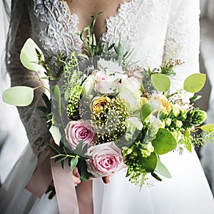 Attractive Beautiful Bride Holding Flowers Bouquet