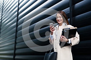 Attractive and beautiful businesswoman standing in office