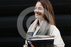 Attractive and beautiful businesswoman standing at office