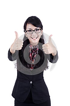 Attractive beautiful businesswoman thumbs up