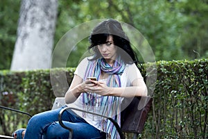 Attractive beautiful latin woman feeling sad and depressed on her phone