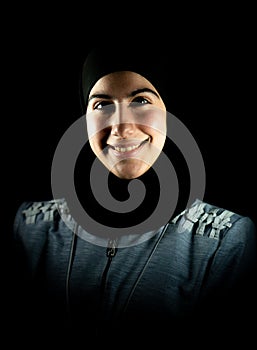 Attractive beautiful nice Muslim woman on black background