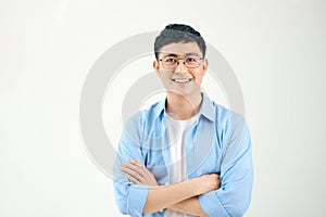 Attractive beautiful smiling positive nerd man. Close up portrait asian man wearing glasses isolated on white background