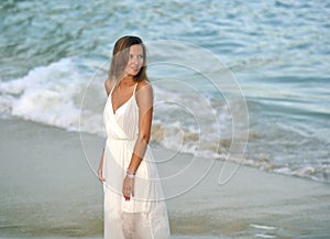 Attractive and beautiful woman enjoying vacation summer holidays at Spain coast village walking on beach