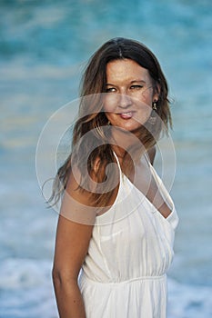 Attractive and beautiful woman enjoying vacation summer holidays at Spain coast village walking on beach