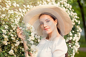 Attractive beautiful woman with flowers outdoors