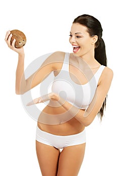 Attractive beautiful woman holding cocnut.