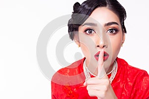 Attractive beautiful young asian woman keep secret, rumor. telling someone donâ€™t tell secrets, rumor or confidential to anyone.