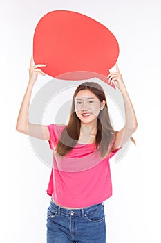 Attractive beautiful young asian woman smile and excited holding empty speech bubble on white background